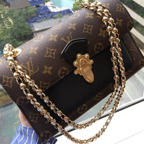 louis vuitton gold chain strap bag|Louis Vuitton wallet with chain.